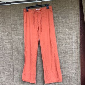 Travis Lucci linen wide leg pants color brick orange.